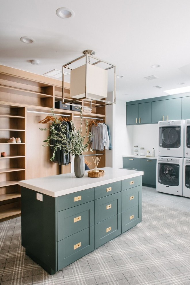 This is an example of a large transitional gender-neutral dressing room in Salt Lake City with shaker cabinets, green cabinets, carpet and grey floor.