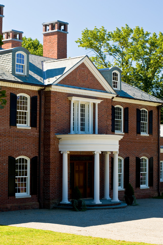 Huge traditional brown two-story brick gable roof idea in New York