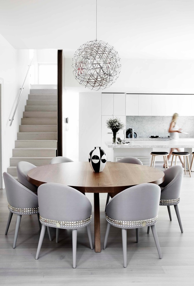Inspiration for a contemporary kitchen/dining combo in Melbourne with white walls.