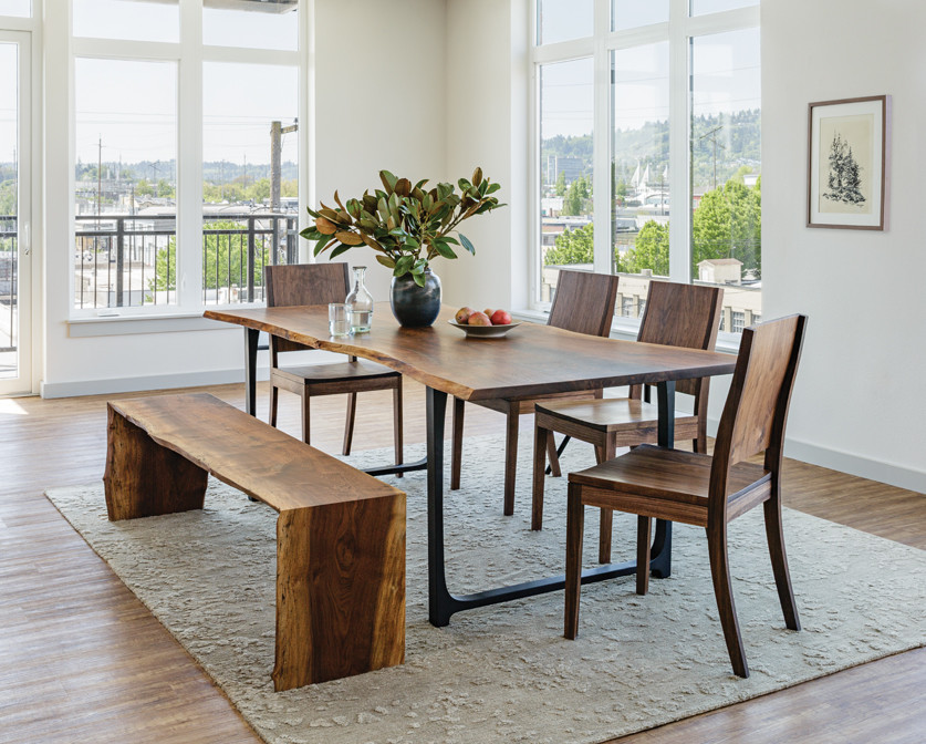Example of a minimalist dining room design in Portland with white walls