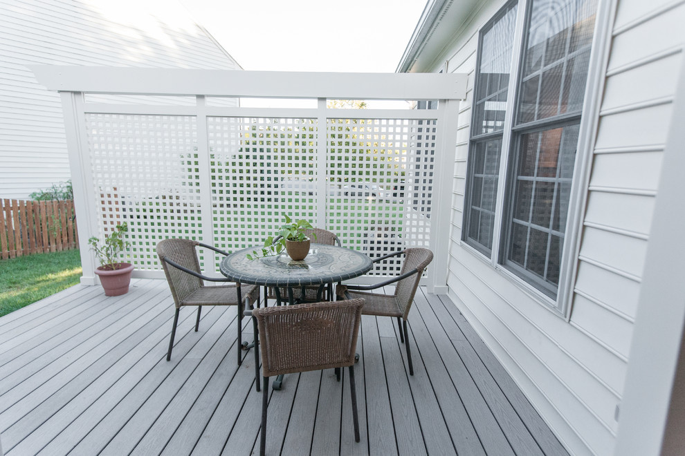 This is an example of a large transitional backyard deck in DC Metro with a pergola.