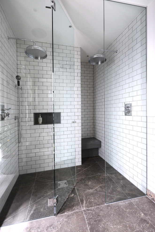 Design ideas for a contemporary bathroom in London with an alcove shower, white tile, subway tile, white walls, a niche and a shower seat.