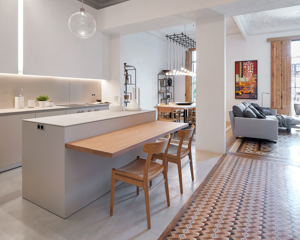 This is an example of a medium sized contemporary single-wall kitchen in Venice with concrete worktops, beige splashback, concrete flooring, an island, grey floors and grey worktops.