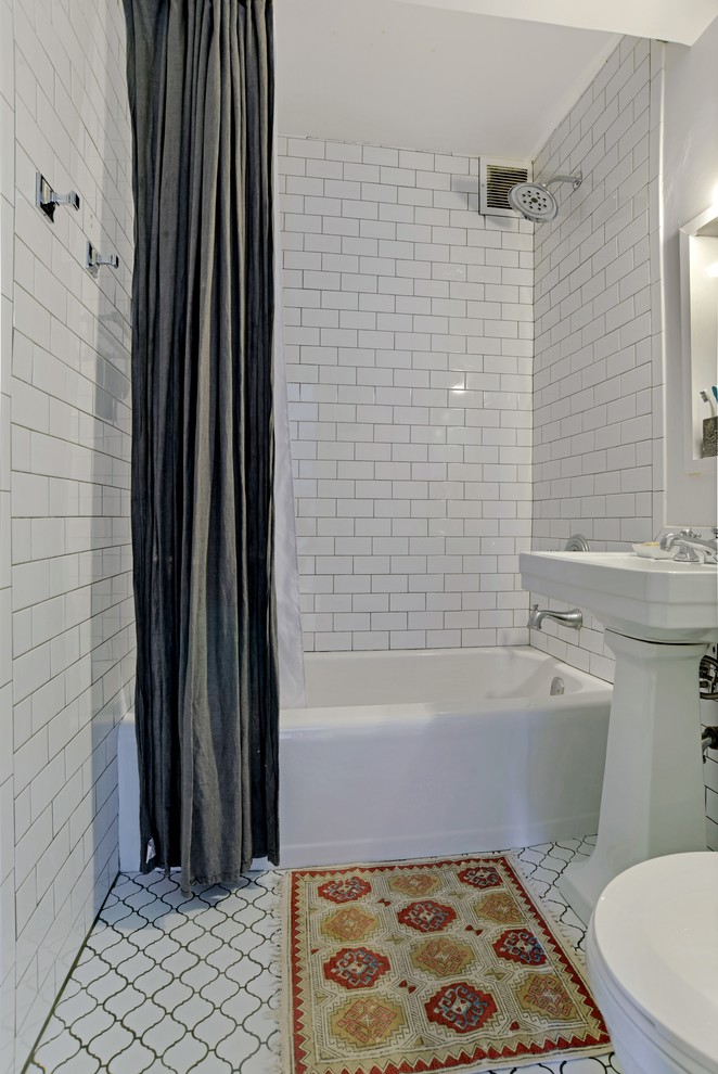 Small country master bathroom in New York with an alcove tub, a two-piece toilet, white tile, ceramic tile, white walls, ceramic floors, a wall-mount sink, white floor, an open shower and a shower/bathtub combo.