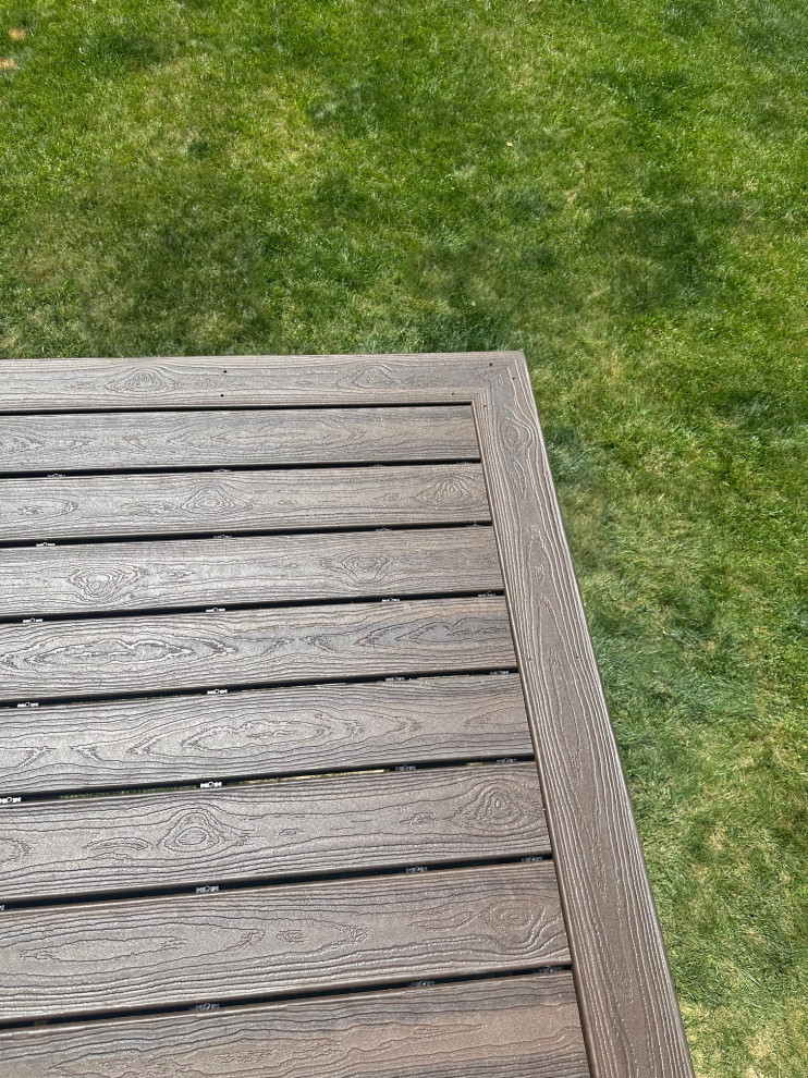Inspiration for a mid-sized backyard ground level metal railing deck remodel in Indianapolis
