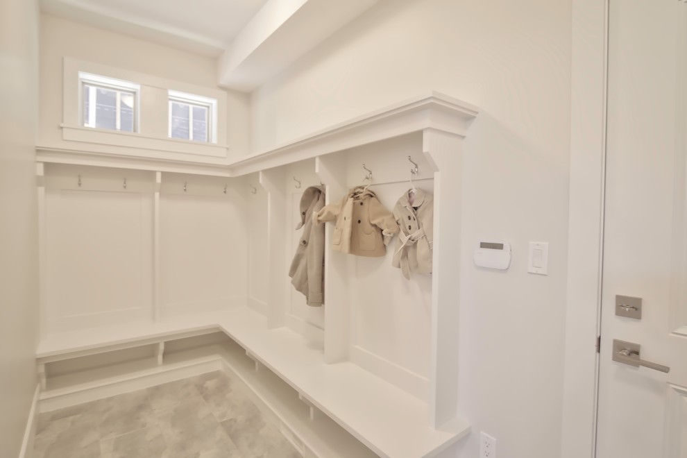 Mid-sized trendy ceramic tile mudroom photo in Vancouver with white walls