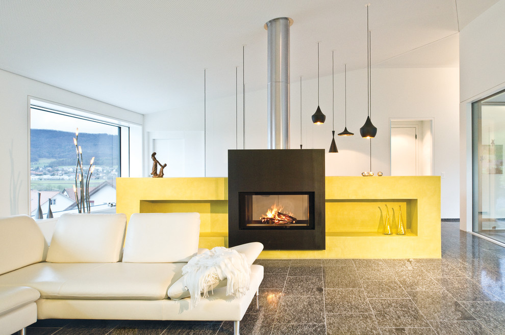 Design ideas for a large contemporary open concept living room in Munich with white walls and a two-sided fireplace.