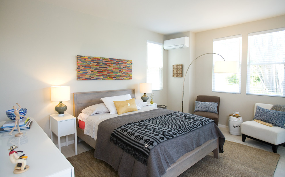 This is an example of a mid-sized transitional guest bedroom in Los Angeles with white walls.