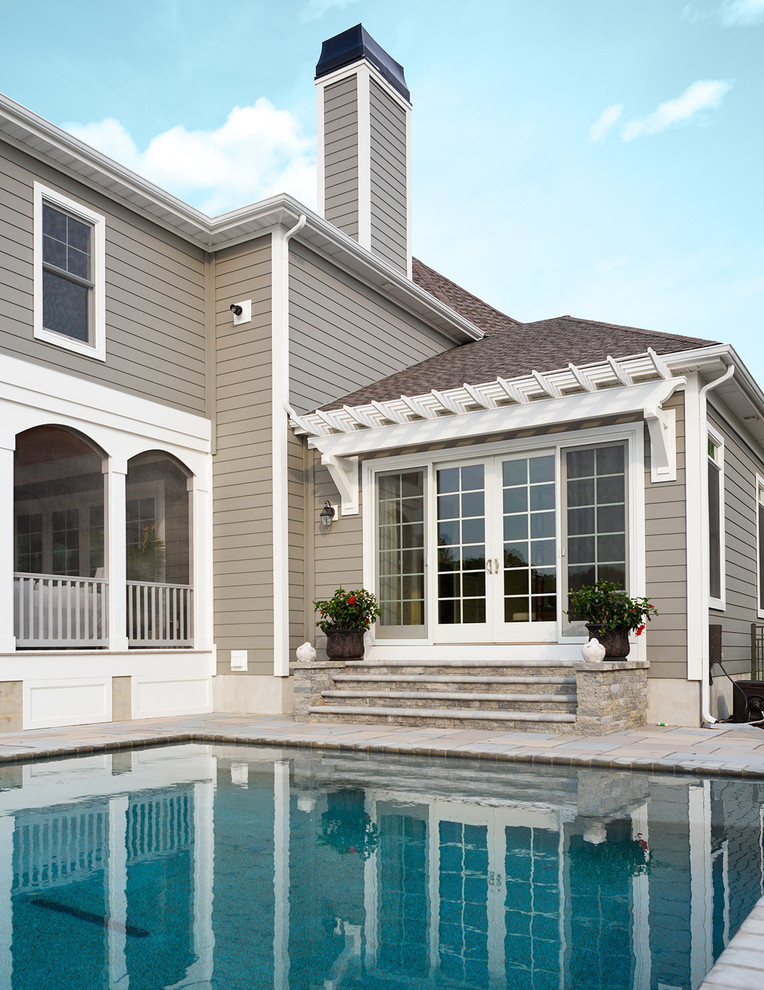 Pool - mid-sized transitional backyard brick and rectangular lap pool idea in Orange County