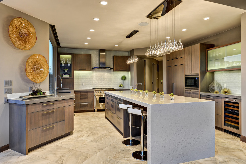 Photo of a transitional u-shaped kitchen in Salt Lake City with an undermount sink, flat-panel cabinets, medium wood cabinets, white splashback, panelled appliances and with island.