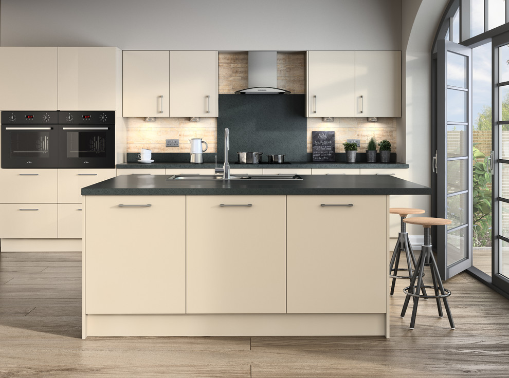 Photo of a mid-sized contemporary separate kitchen in West Midlands with laminate benchtops, grey splashback, panelled appliances and with island.