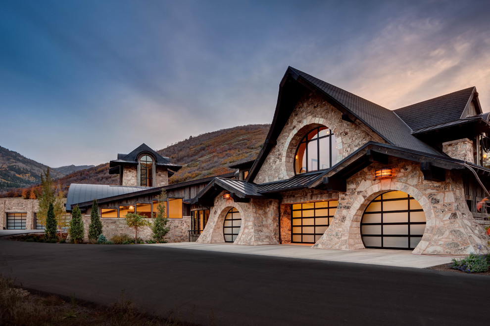 This is an example of a large transitional attached three-car garage in Salt Lake City.