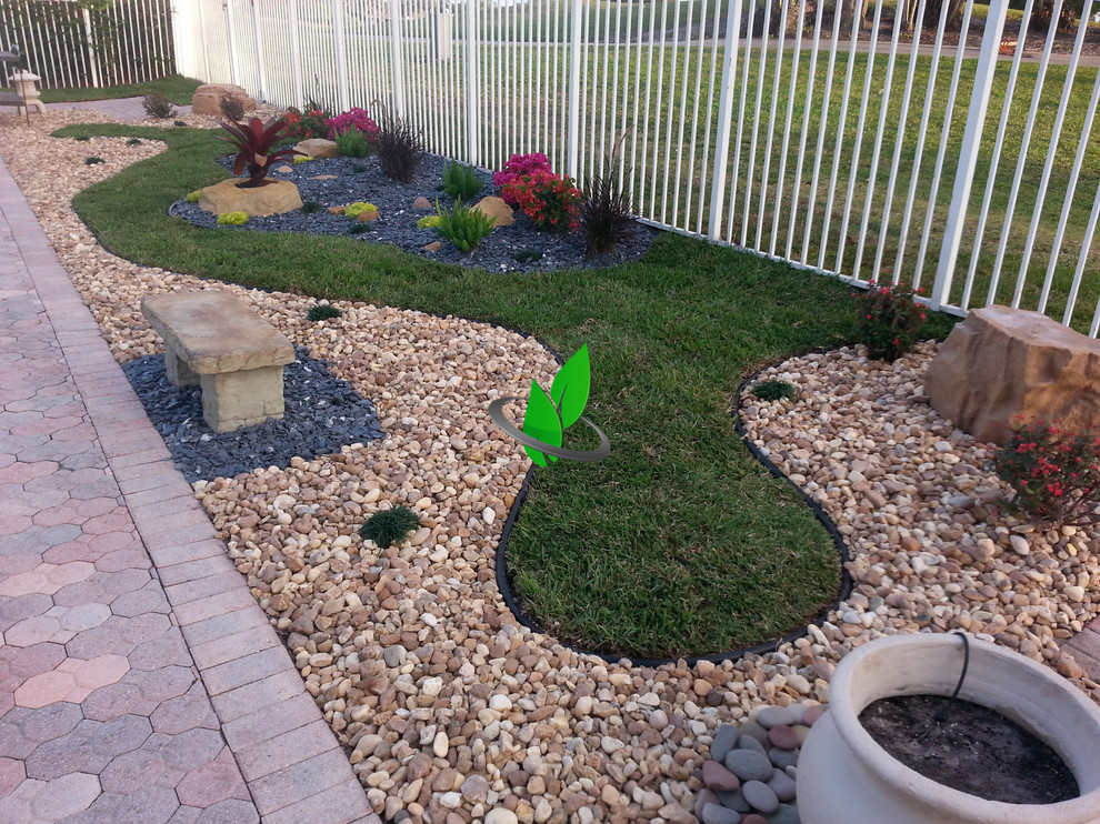 Photo of a mediterranean backyard landscaping.