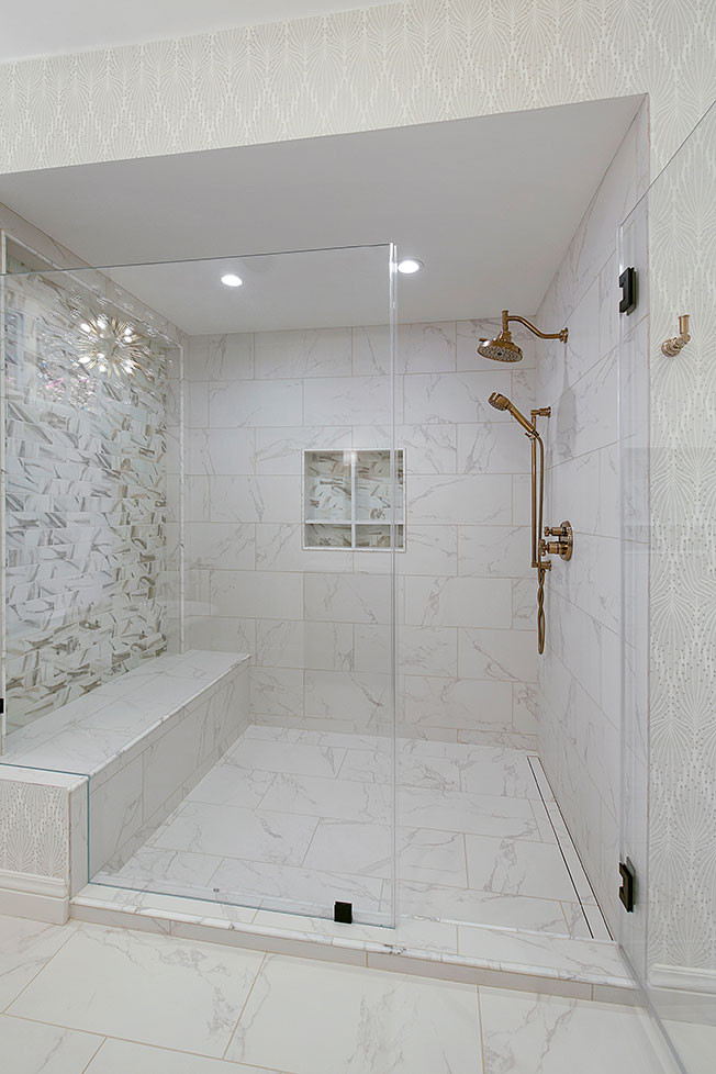 Inspiration for a large transitional master bathroom in San Francisco with recessed-panel cabinets, dark wood cabinets, a freestanding tub, an alcove shower, a two-piece toilet, white tile, marble, beige walls, marble floors, an undermount sink, engineered quartz benchtops, white floor, a hinged shower door, white benchtops, a shower seat, a double vanity, a built-in vanity, vaulted and wallpaper.