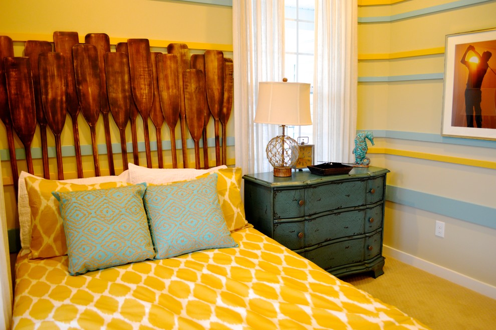 This is an example of a beach style guest bedroom in DC Metro with carpet.