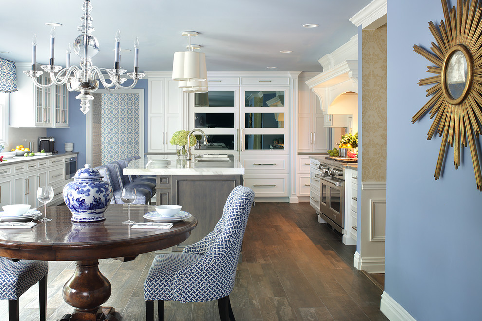 Open concept kitchen - large transitional u-shaped ceramic tile open concept kitchen idea in New York with an undermount sink, white cabinets, marble countertops, white backsplash, porcelain backsplash, paneled appliances and an island