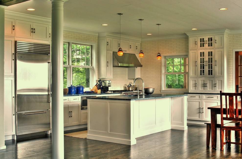 This is an example of a traditional kitchen in New York with subway tile splashback and soapstone benchtops.