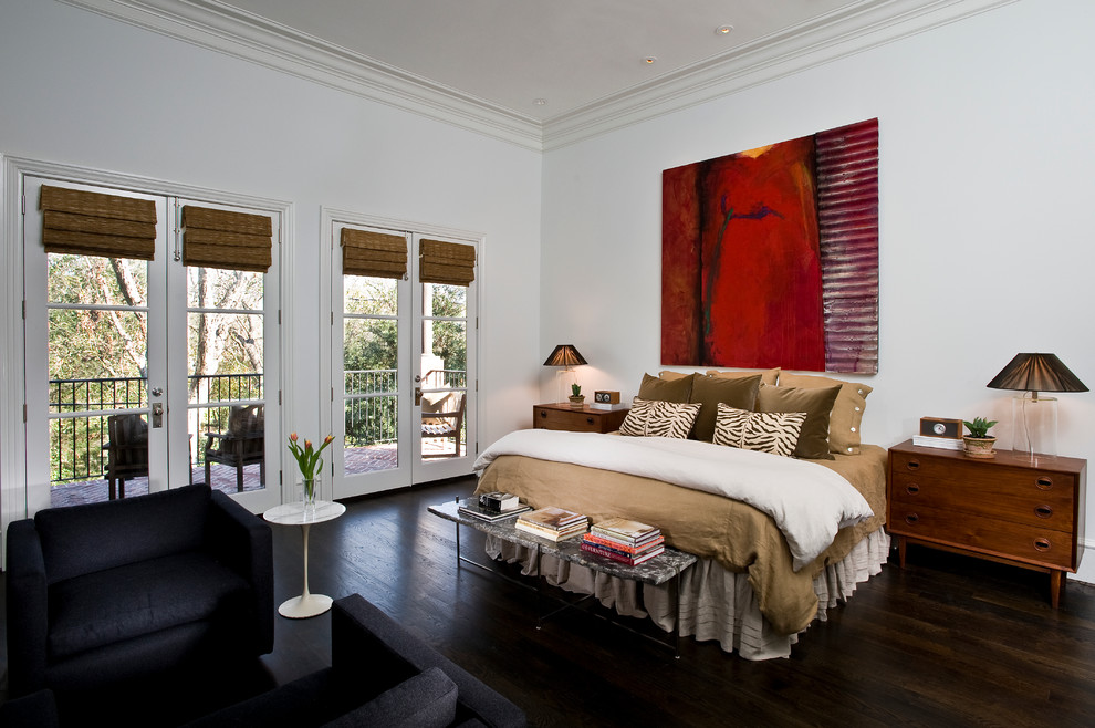 Inspiration for a traditional master bedroom in Houston with white walls and dark hardwood floors.
