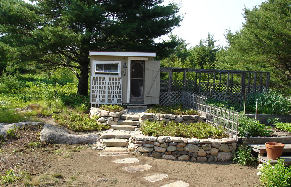 Inspiration for a rustic backyard stone home design remodel