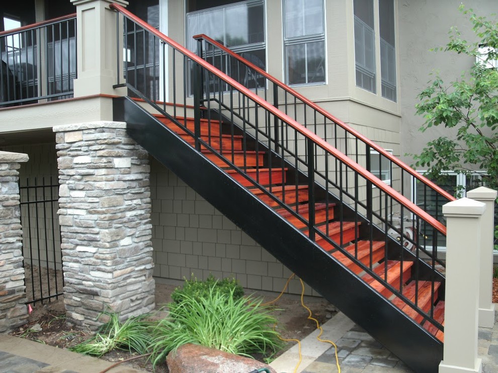 Staircase - mid-sized transitional wooden straight staircase idea in Minneapolis with wooden risers