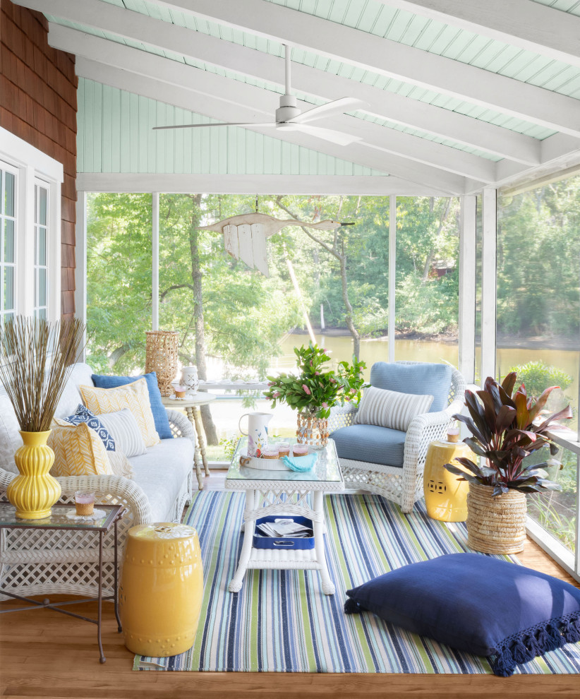 Design ideas for a beach style screened-in verandah in Baltimore with decking and a roof extension.