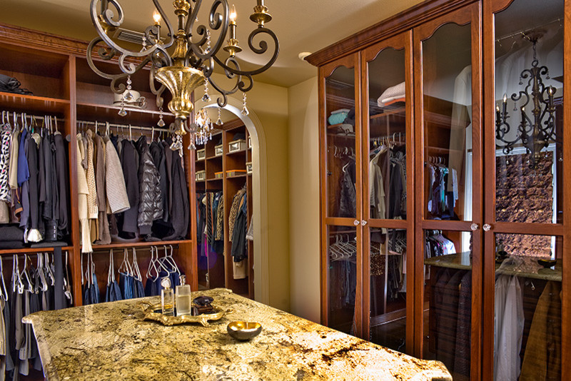 This is an example of a mediterranean storage and wardrobe in Tampa.