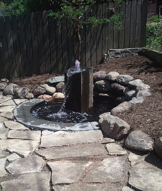 Design ideas for a mid-sized rustic partial sun backyard gravel formal garden for spring.