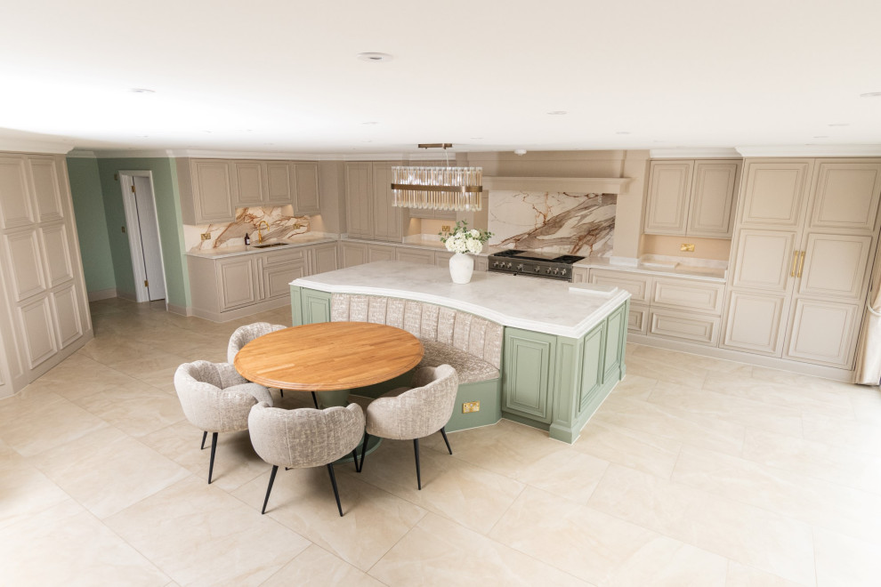 Design ideas for an expansive contemporary l-shaped open plan kitchen in Essex with a double-bowl sink, shaker cabinets, grey cabinets, quartzite benchtops, orange splashback, porcelain splashback, stainless steel appliances, travertine floors, with island, brown floor and white benchtop.