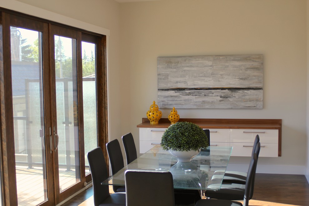 Kitchen/dining room combo - large contemporary dark wood floor kitchen/dining room combo idea in Calgary with beige walls