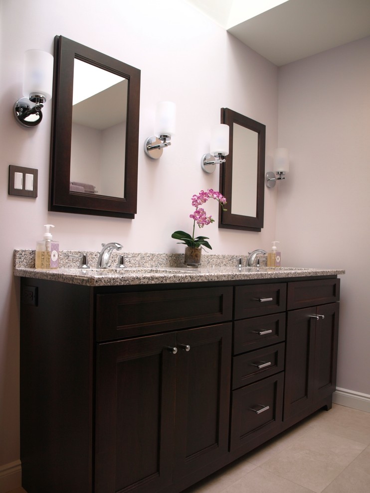 Design ideas for a large transitional master bathroom in Newark with flat-panel cabinets, brown cabinets, an alcove shower, a two-piece toilet, beige tile, ceramic tile, beige walls, porcelain floors, an undermount sink, granite benchtops, beige floor and a sliding shower screen.