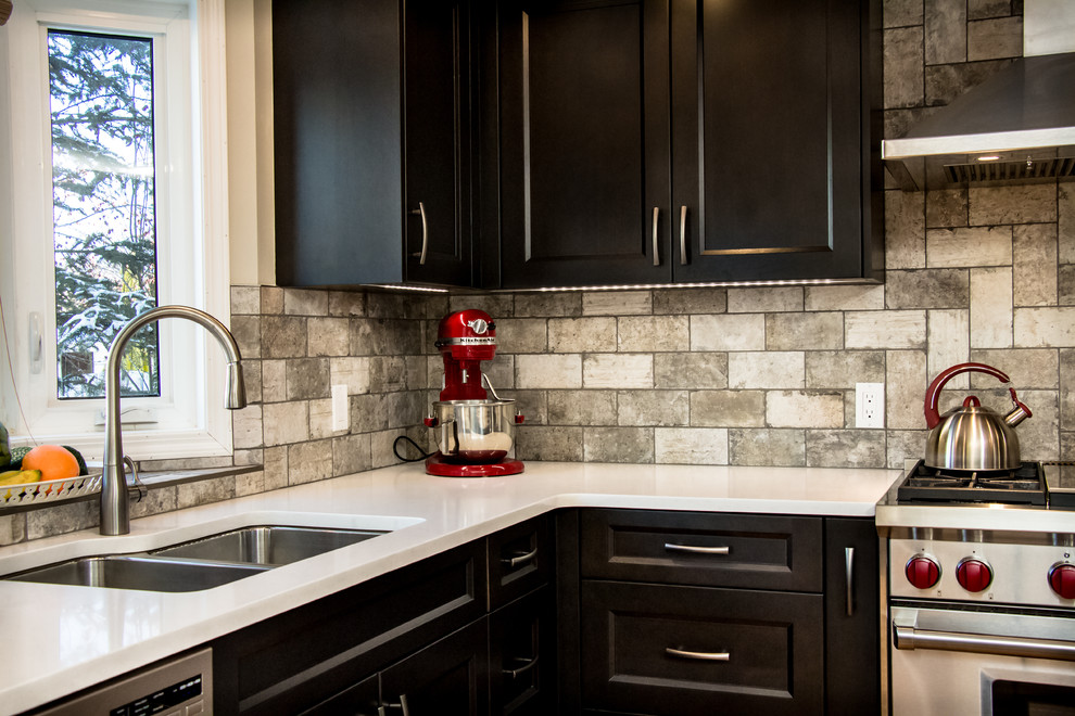 Example of a transitional kitchen design in Calgary