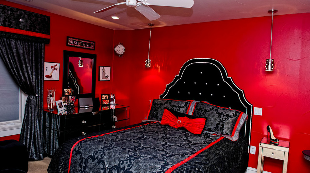 Photo of a mid-sized traditional master bedroom in Denver with red walls, carpet and no fireplace.