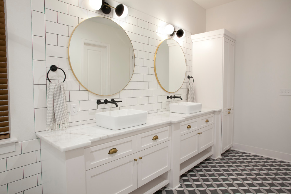 Design ideas for a large contemporary master bathroom in Other with shaker cabinets, red cabinets, white tile, subway tile, white walls, porcelain floors, a vessel sink, marble benchtops, multi-coloured floor and white benchtops.