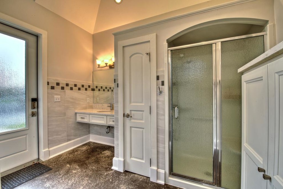 Design ideas for a large traditional wet room bathroom in Indianapolis with shaker cabinets, white cabinets, gray tile, porcelain tile, grey walls, concrete floors, with a sauna, an undermount sink, engineered quartz benchtops, multi-coloured floor and a hinged shower door.