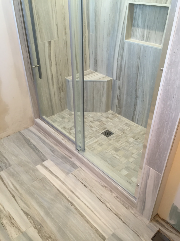 Alcove shower - mid-sized transitional 3/4 gray tile and porcelain tile porcelain tile and brown floor alcove shower idea in Ottawa