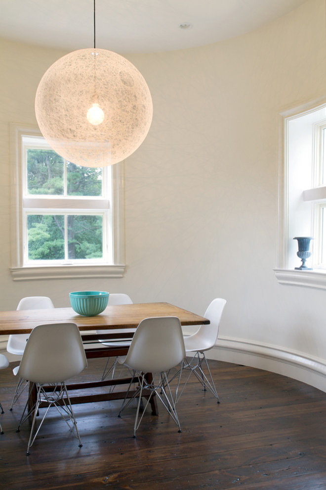 Inspiration for a contemporary dining room in Chicago with white walls and dark hardwood floors.