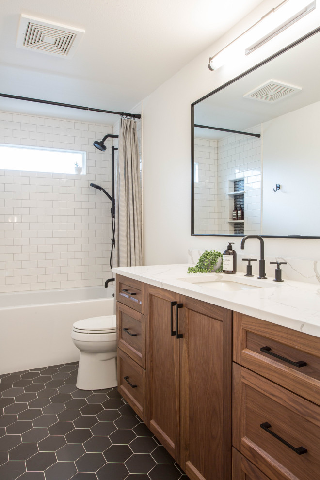 Mid-sized modern 3/4 bathroom in Seattle with shaker cabinets, medium wood cabinets, an alcove tub, an alcove shower, a two-piece toilet, white tile, subway tile, white walls, porcelain floors, an undermount sink, engineered quartz benchtops, black floor, a shower curtain, white benchtops, a niche, a single vanity and a built-in vanity.