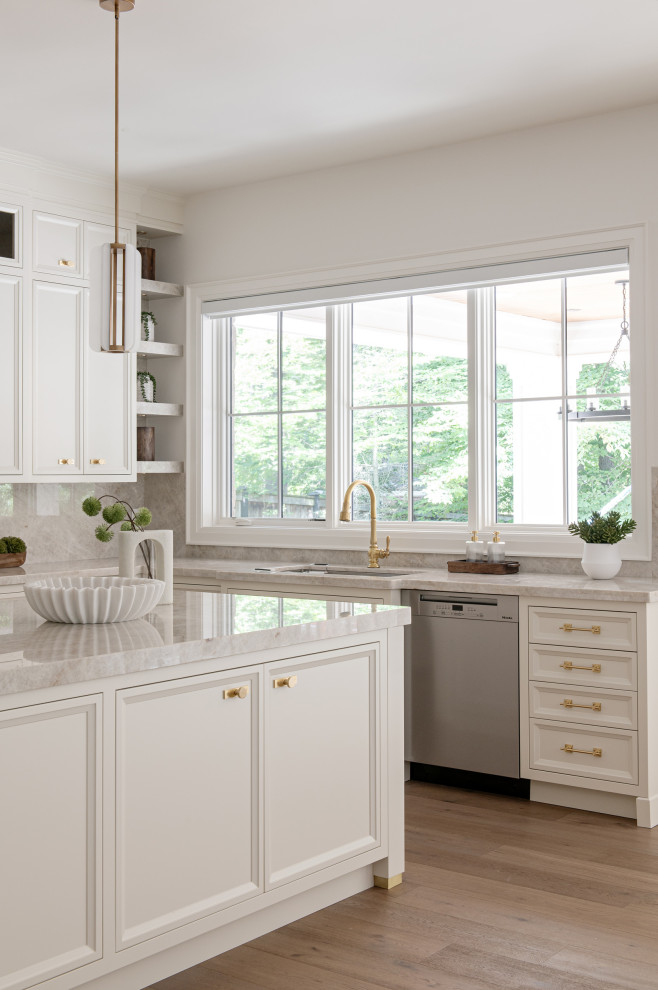 Inspiration for a large transitional u-shaped light wood floor eat-in kitchen remodel in Toronto with an undermount sink, recessed-panel cabinets, white cabinets, quartz countertops, multicolored backsplash, quartz backsplash, stainless steel appliances, an island and multicolored countertops