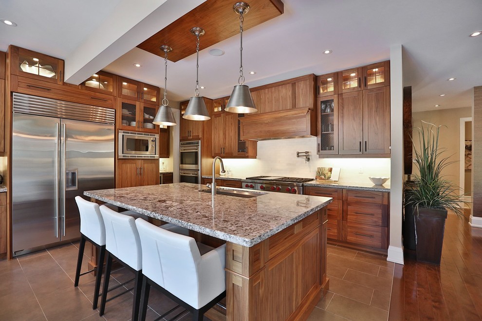 Example of a transitional kitchen design in Toronto
