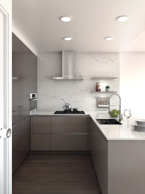 Compact U-shaped kitchen with handleless cabinets and a built-in pantry wall