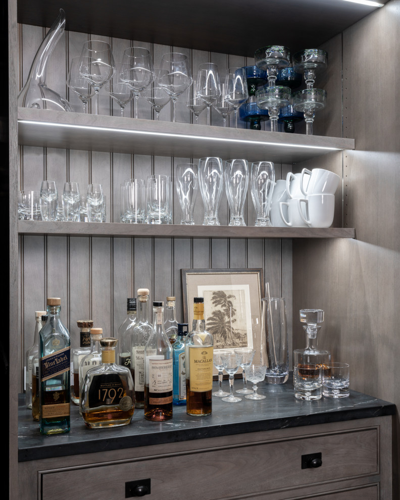 Example of a small transitional galley dark wood floor and brown floor eat-in kitchen design in New York with an undermount sink, flat-panel cabinets, gray cabinets, marble countertops, white backsplash, marble backsplash, stainless steel appliances, no island and white countertops