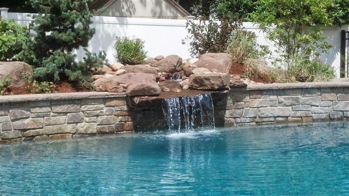 Pool fountain - large transitional backyard stone and rectangular full sun and natural pool fountain idea in Boston