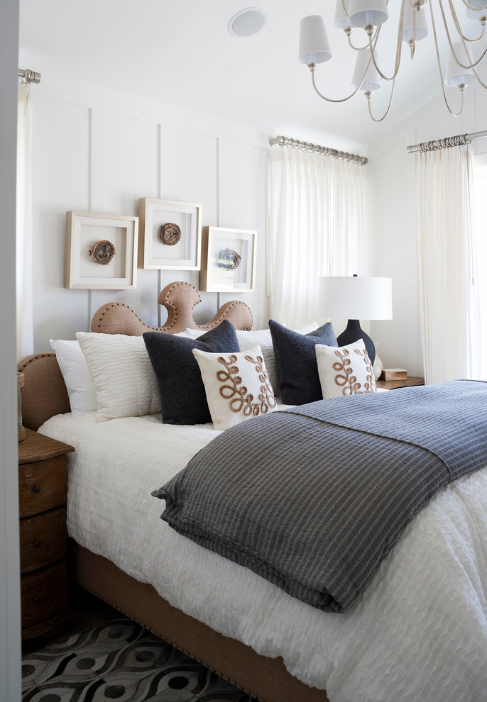 This is an example of a beach style bedroom in DC Metro with white walls.