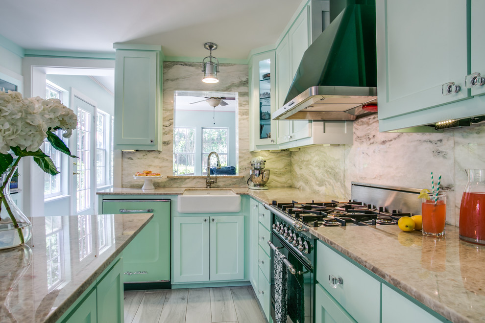 Inspiration for a small eclectic l-shaped eat-in kitchen in Dallas with a farmhouse sink, shaker cabinets, green cabinets, quartzite benchtops, green splashback, stone slab splashback, coloured appliances, ceramic floors and with island.