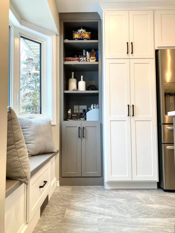 Enclosed kitchen - mid-sized transitional galley ceramic tile and gray floor enclosed kitchen idea with a double-bowl sink, shaker cabinets, white cabinets, quartz countertops, gray backsplash, ceramic backsplash, stainless steel appliances, an island and white countertops