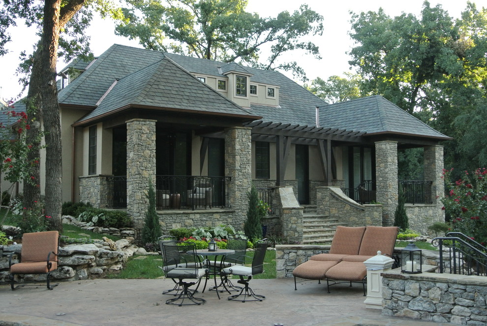 Mid-sized mountain style beige one-story mixed siding gable roof photo with a shingle roof
