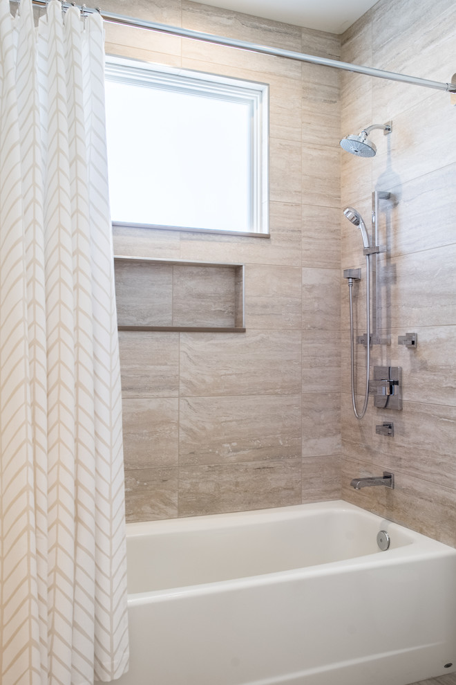 Mid-sized mountain style 3/4 porcelain tile and beige floor tub/shower combo photo in Phoenix with dark wood cabinets, beige walls, an undermount sink, solid surface countertops and beige countertops