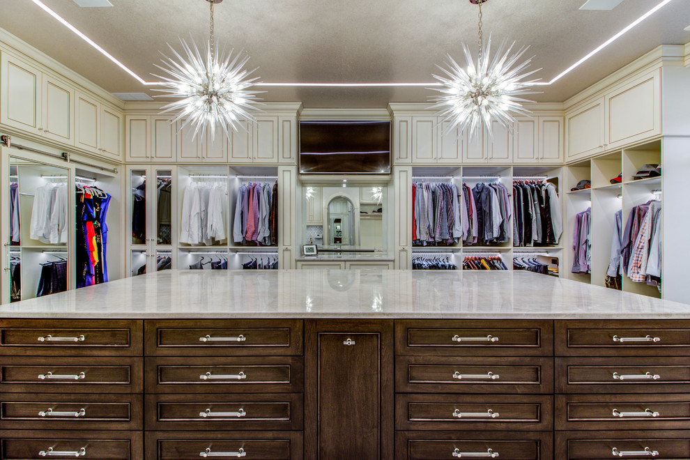 Inspiration for a large contemporary gender-neutral walk-in wardrobe in Cleveland with shaker cabinets and beige cabinets.