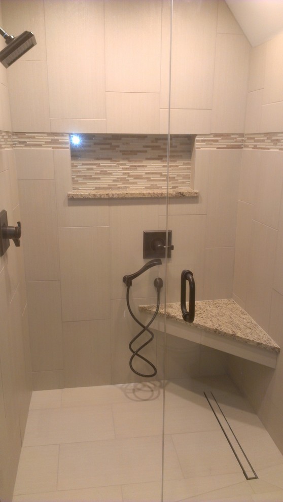 Alcove shower - modern pink tile and white tile ceramic tile alcove shower idea in Kansas City with recessed-panel cabinets, medium tone wood cabinets, purple walls, an undermount sink and granite countertops
