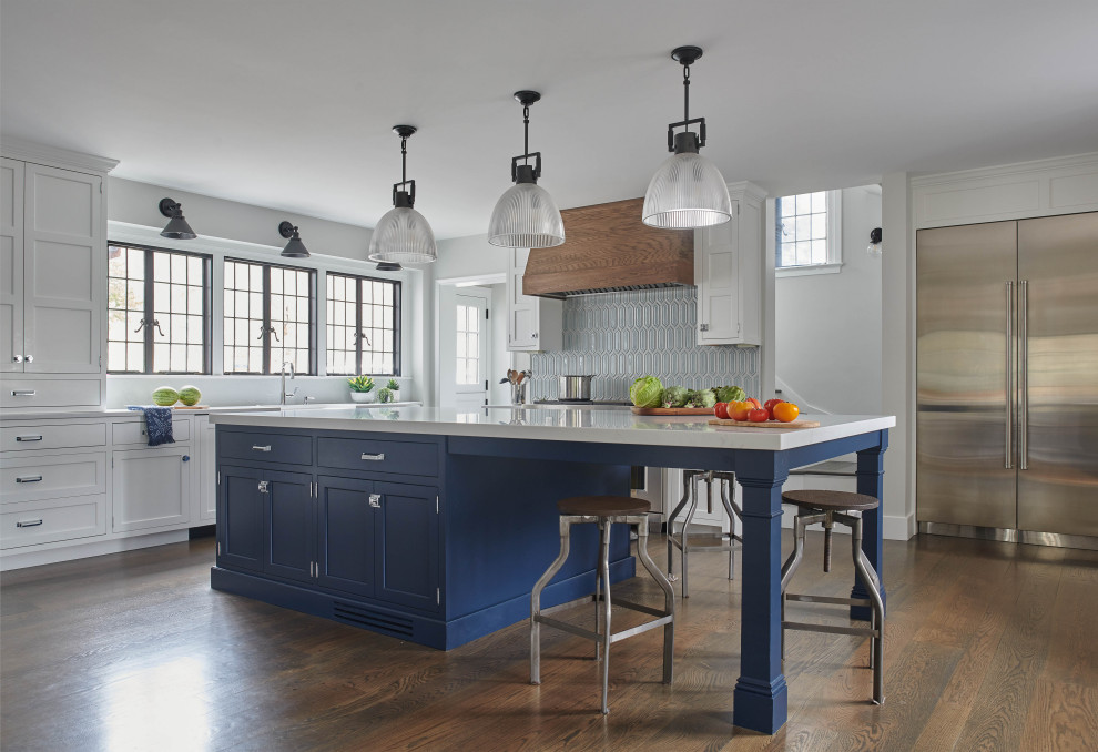 Inspiration for a transitional kitchen remodel with white cabinets, an island and stainless steel appliances
